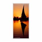 Silhouette and reflection of an elegant felucca at sunset. The River Nile, Egypt.